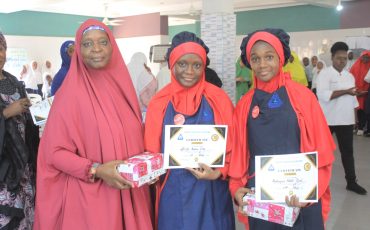 The Director, Great Heights Academy posing with the winners